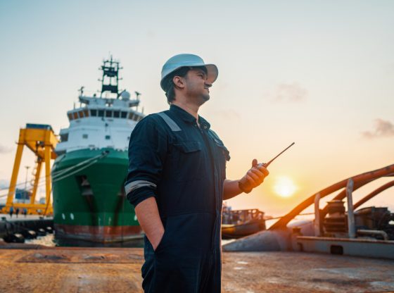 Man Standing at Dublin Dock with walkie-talkies