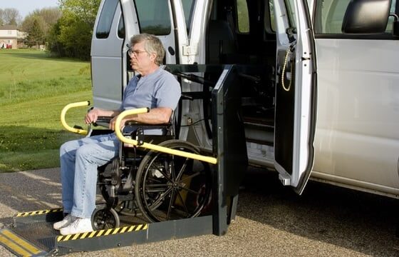 Man coming down a mobility Lift from a van