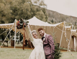 Bride and Groom in Front of a Large Stretch Tent