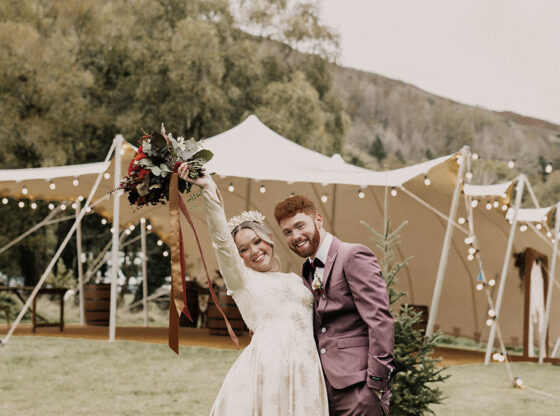 Bride and Groom in Front of a Large Stretch Tent